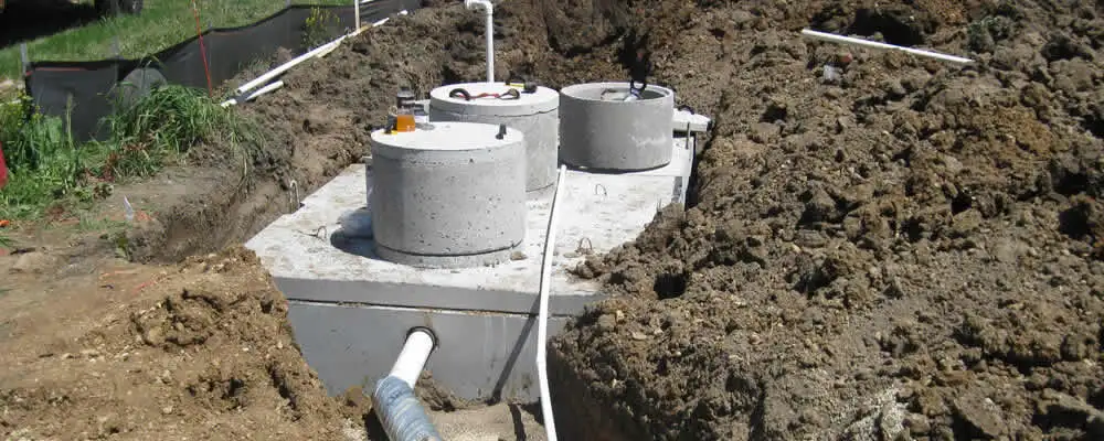Septic system repair and installation site with tank access ports in Providence, RI
