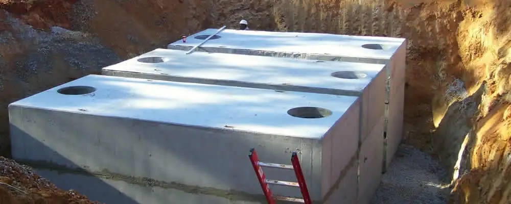Septic tank installation site with a newly placed concrete tank in Providence, RI
